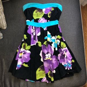Strapless black mini dress with purple flowers
